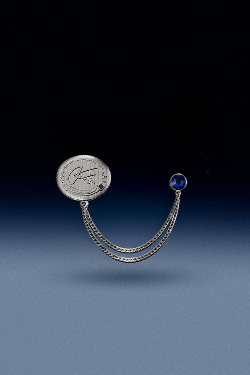 Custom double layered chain lapel metal hat pin with a blue rhinstone each with a metal butterfly back fastener.